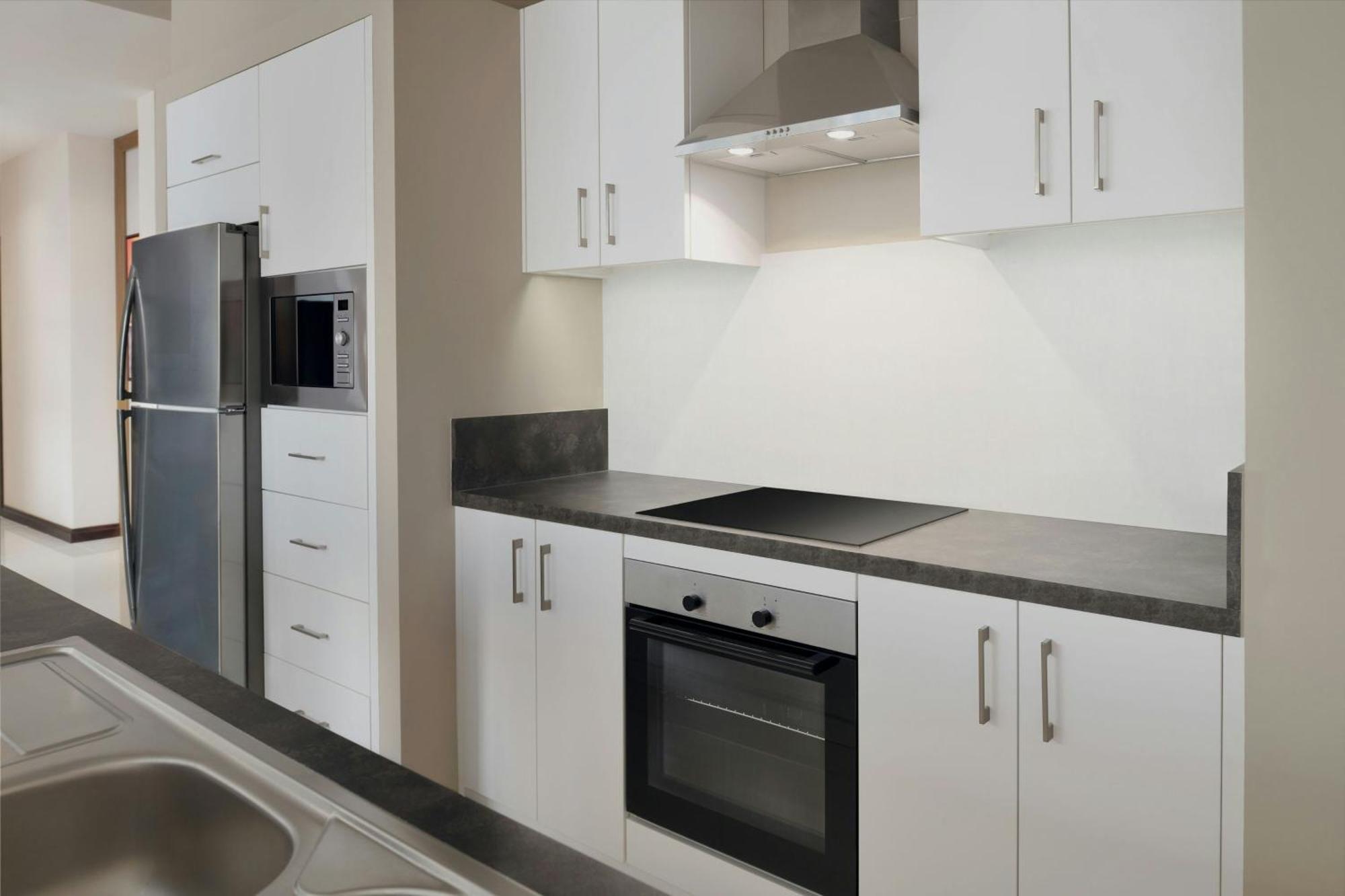 Delta Hotels By Marriott City Center Doha Ngoại thất bức ảnh A typical kitchen in a student apartment